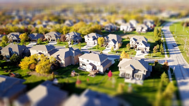 An overhead view of a suburban neighborhood in summer